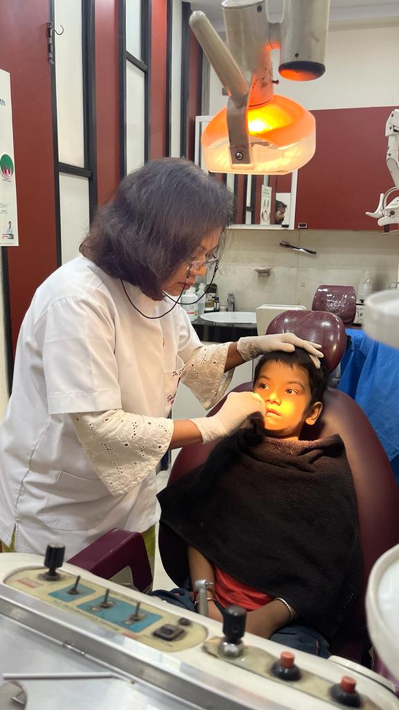 our best dentist checking its patient in smile signature